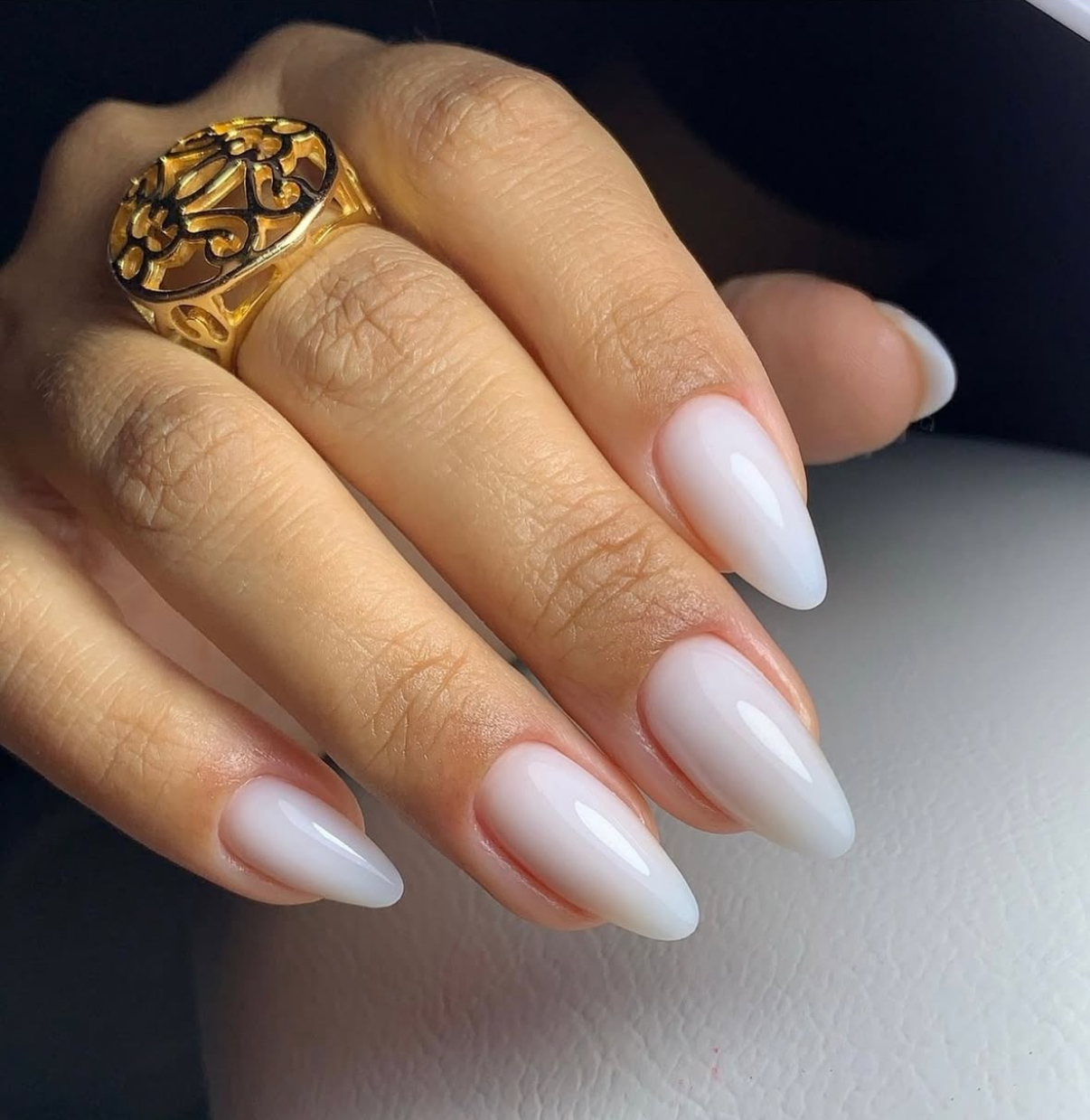 Milky white stiletto nails