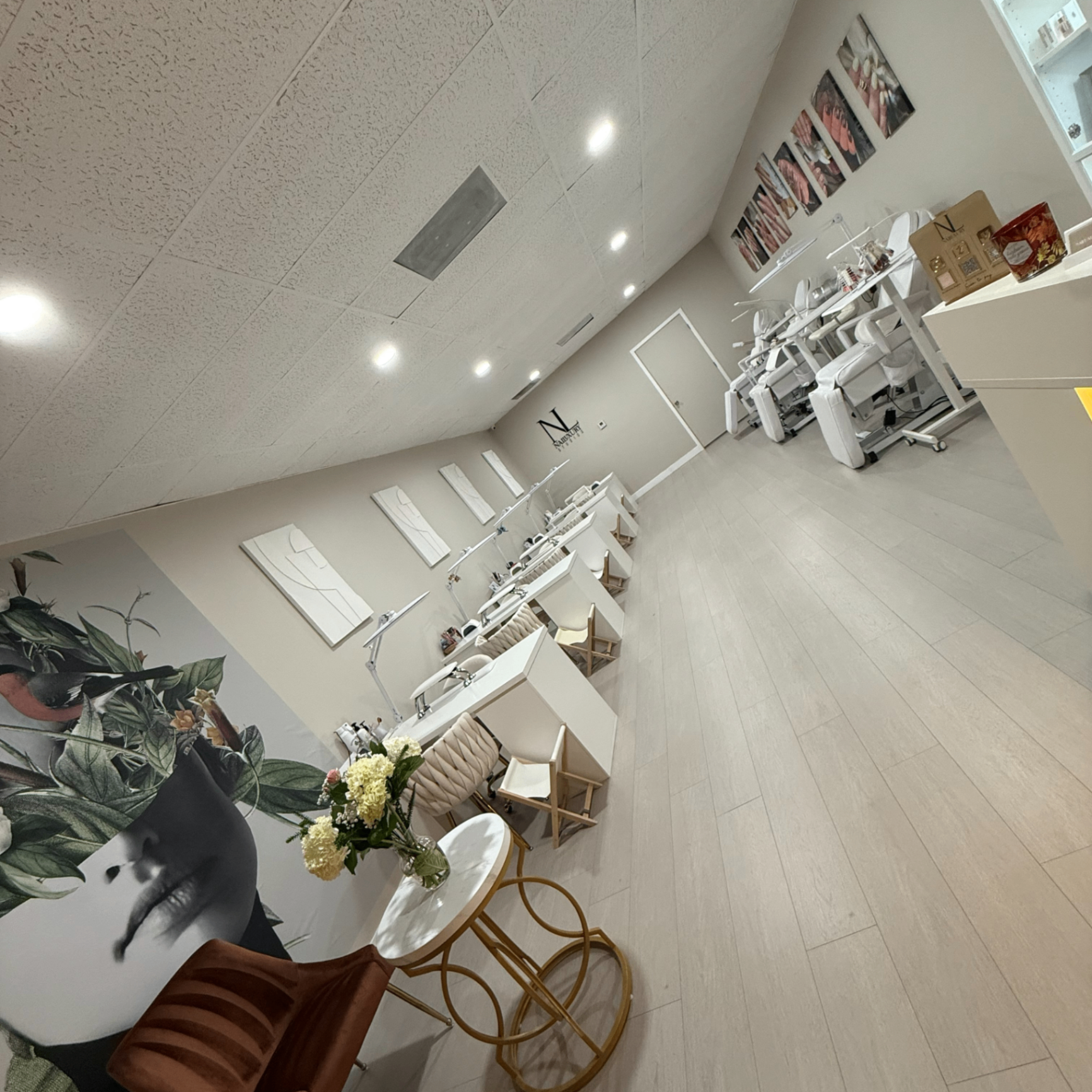 Inside Nailuxury Studios — manicure stations and lounge area